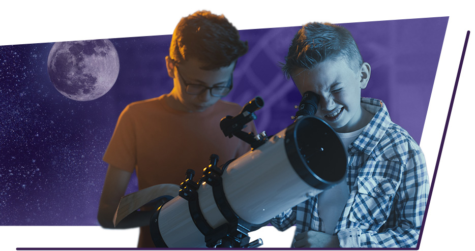 Two boys peer into a telescope