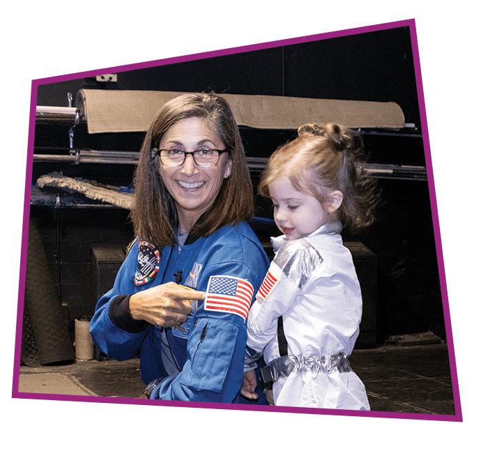 IMAGE-DONATE-nicole-stott-with-girl Astronaut Nicole Stott meets with a little girl